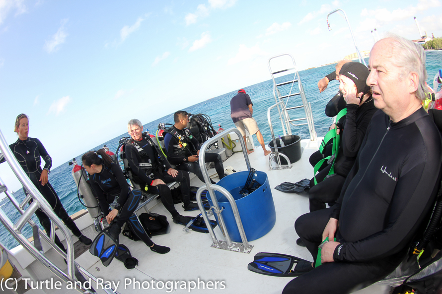 Dive briefing by Dive Master Karen Maike on left. Angela, Pat, Rahim, Scott's arm, Brenda and Paul (wondering where he is)